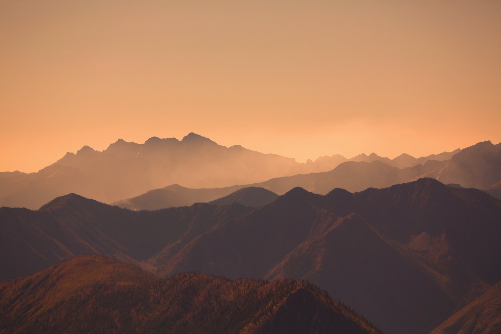 Layered mountain ridges glowing at sunset above the Methow Valley