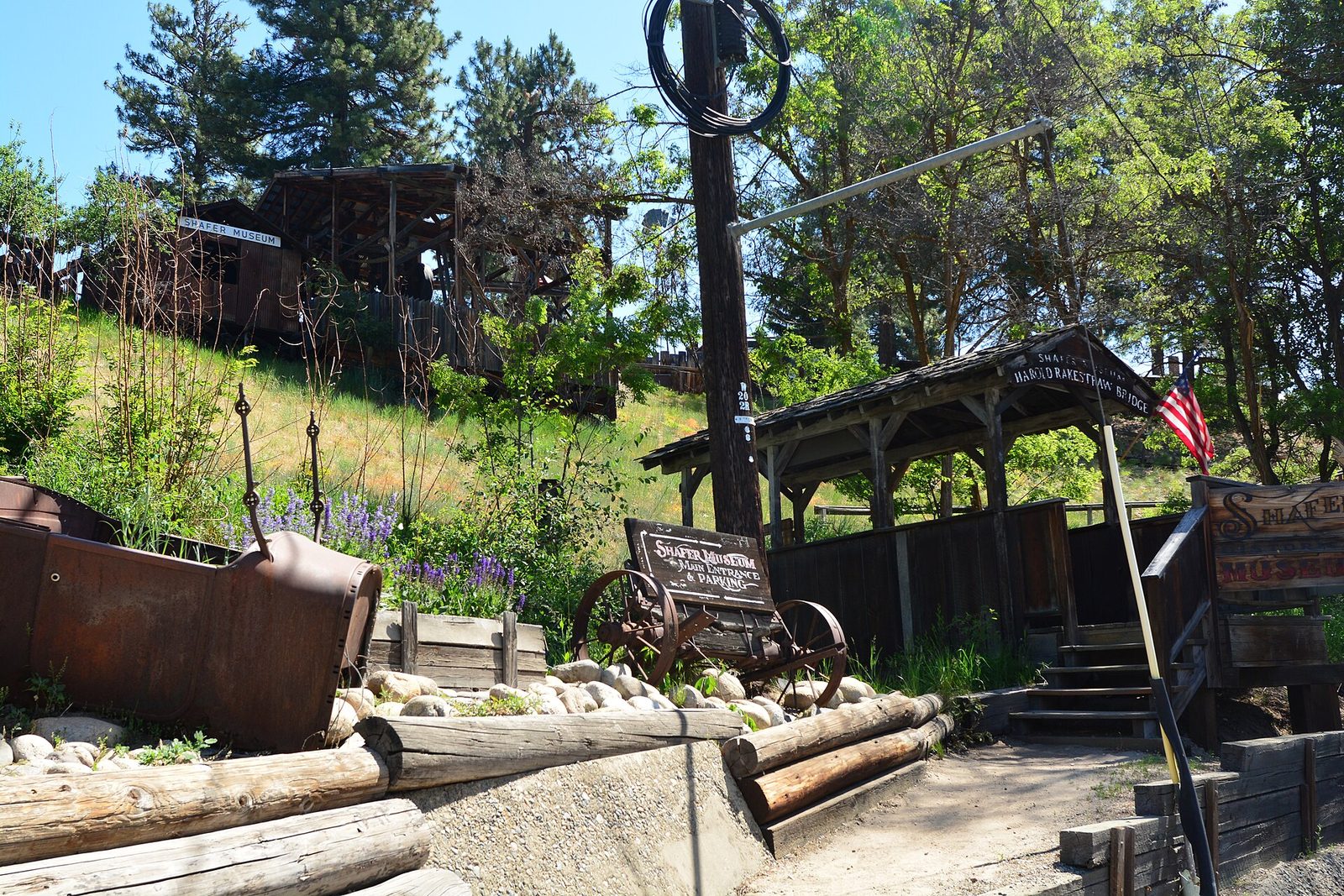 Historic log buildings and mining equipment at the Shafer Historical Museum in Winthrop